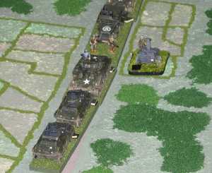 Elements of 9th US Armored Division pass an abandoned Field Kitchen.  Tim Gow