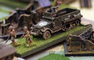US troops advance through a German twon.  Tom Mouat